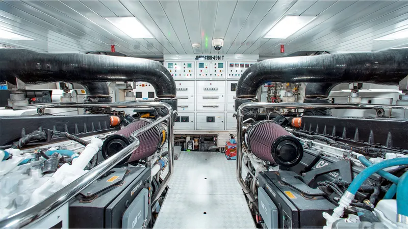 Slide: The Image of Engine room of 2010 Azimut 95 yacht, featuring dual engines and control panels. - 25
