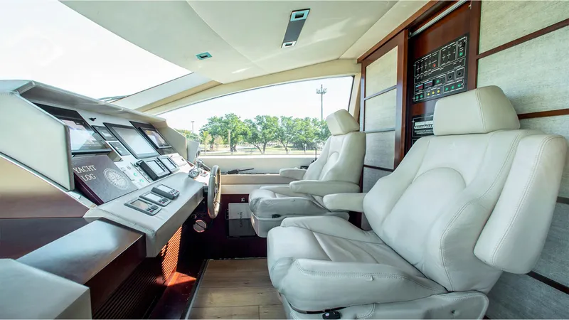 Slide: The Image of Luxurious interior of 2010 Azimut 95 yacht with modern cockpit and plush seating. - 8