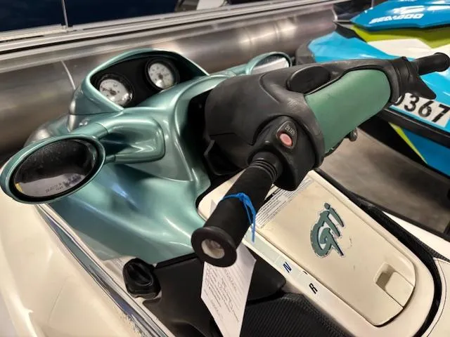 Slide: The Image of 2000 Sea-Doo GTI jet ski handlebars and dashboard close-up. - 9
