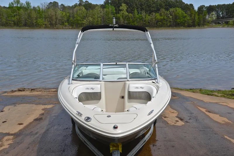 Slide: The Image of 2005 Sea Ray 220 Select boat on a trailer by a lake. - 16