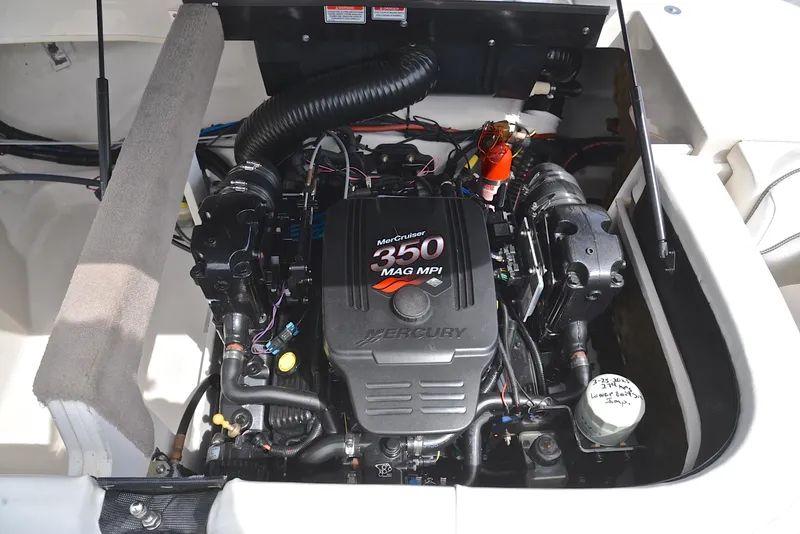Slide: The Image of 2005 Sea Ray 220 Select boat engine, featuring a powerful Mercury 350 MAG MPI. - 25