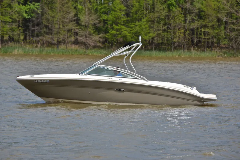 Slide: The Image of 2005 Sea Ray 220 Select boat on calm water with forested background. - 8