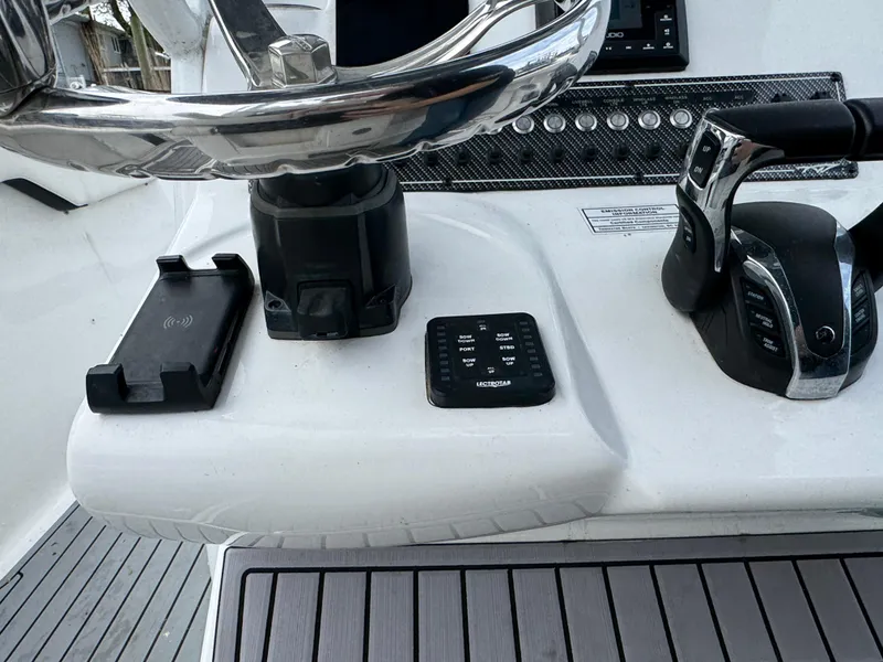 Slide: The Image of 2022 Tidewater 292 CC Adventure helm with steering wheel and controls. - 15
