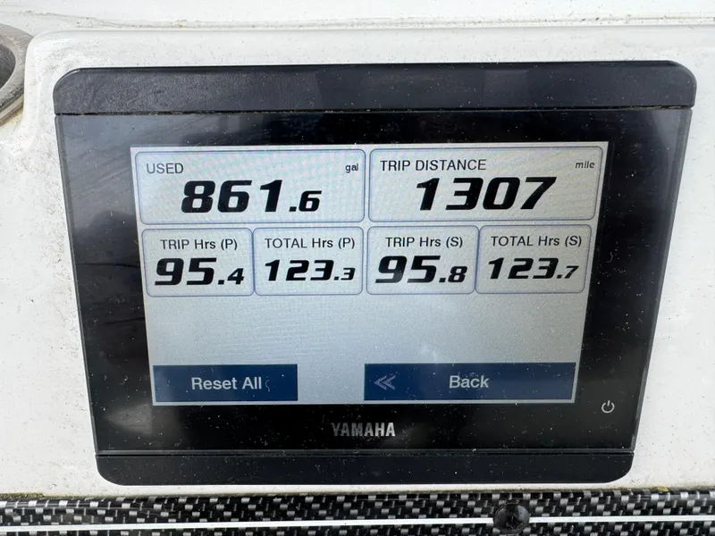 Slide: The Image of Yamaha display showing fuel usage and trip data for 2022 Tidewater 292 CC Adventure. - 28