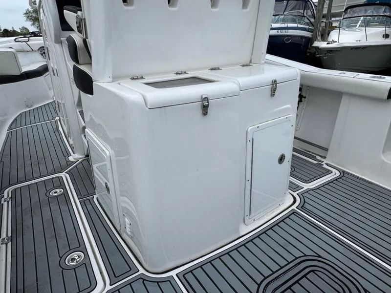 Slide: The Image of 2022 Tidewater 292 CC Adventure boat interior with sleek storage compartments and non-slip flooring. - 6