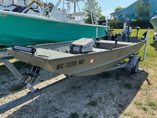 Slide: The Image of 2016 Crestliner CR 1448T boat on trailer, parked outdoors. - 1