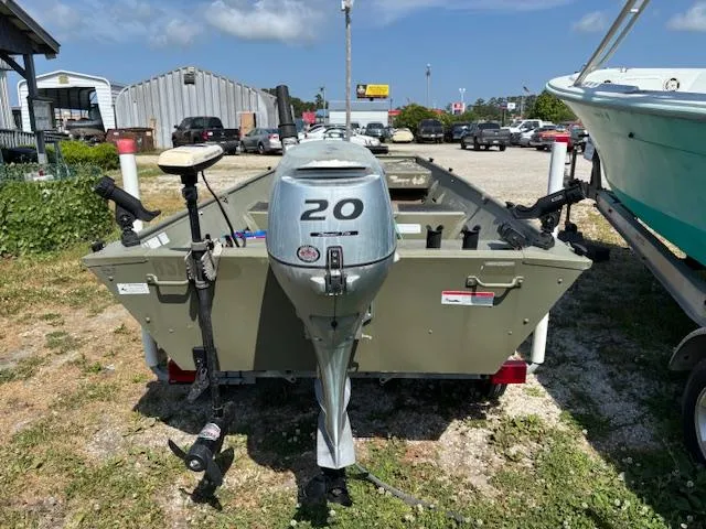 Slide: The Image of 2016 Crestliner CR 1448T boat with 20 HP motor in outdoor setting. - 3