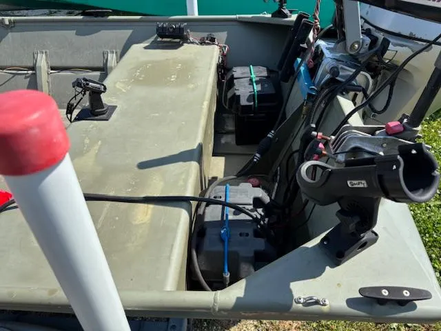 Slide: The Image of 2016 Crestliner CR 1448T boat interior with equipment and battery setup. - 9