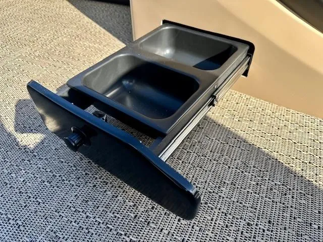 Slide: The Image of Barletta C24UE 2025 boat cup holder on textured surface, showcasing dual compartments. - 19