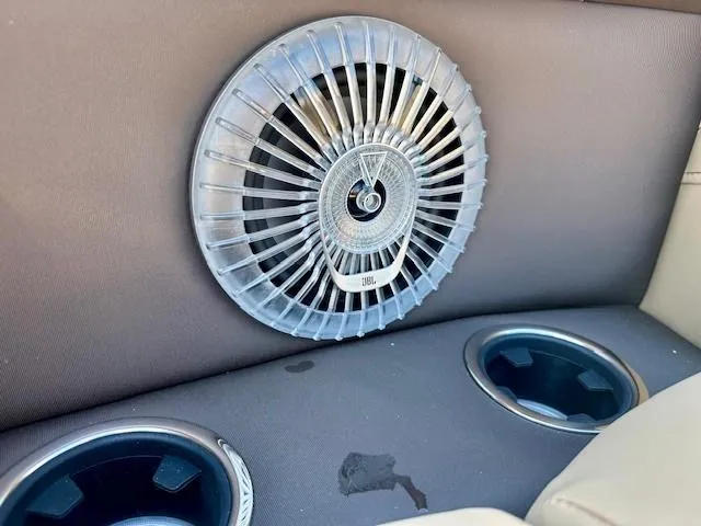 Slide: The Image of Speaker and cup holders in 2025 Barletta C24UE boat interior. - 21