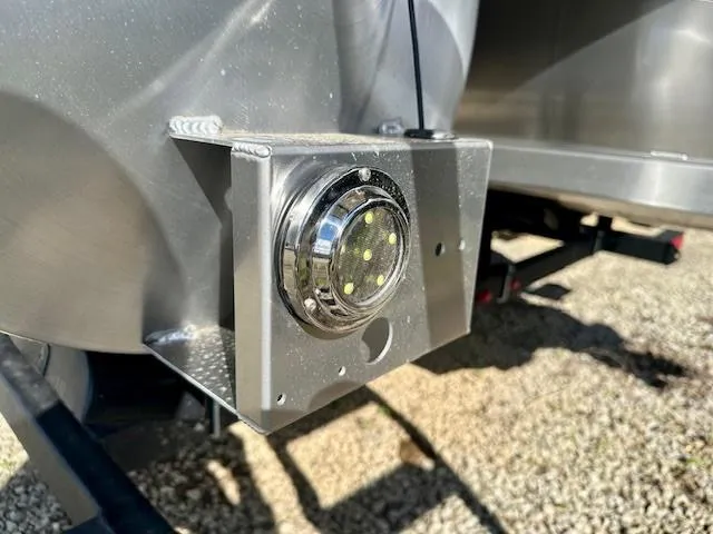 Slide: The Image of Close-up of a 2025 Barletta C24UE boat component with a circular LED light. - 23