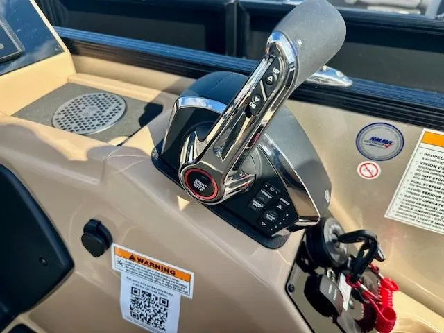 Slide: The Image of Throttle control of 2025 Barletta C24UE boat with warning labels and QR code. - 6