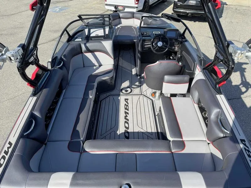 Slide: The Image of 2021 Moomba Craz boat interior with spacious seating and modern dashboard design. - 8
