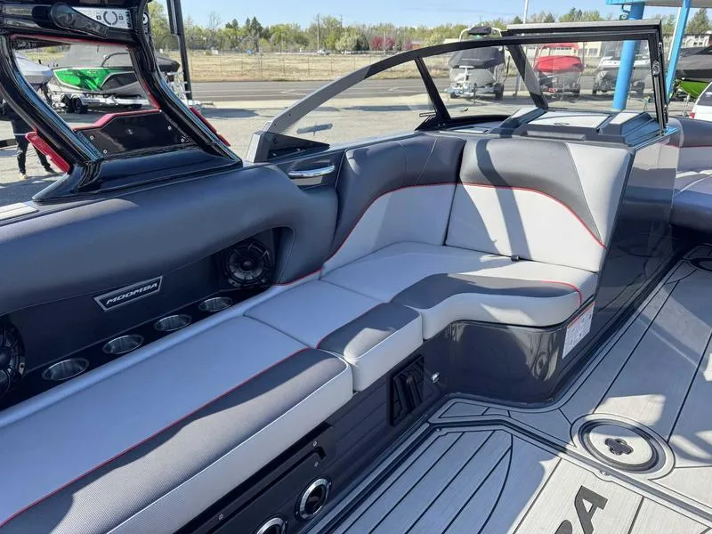 Slide: The Image of 2021 Moomba Craz boat interior with gray seating and modern design. - 9