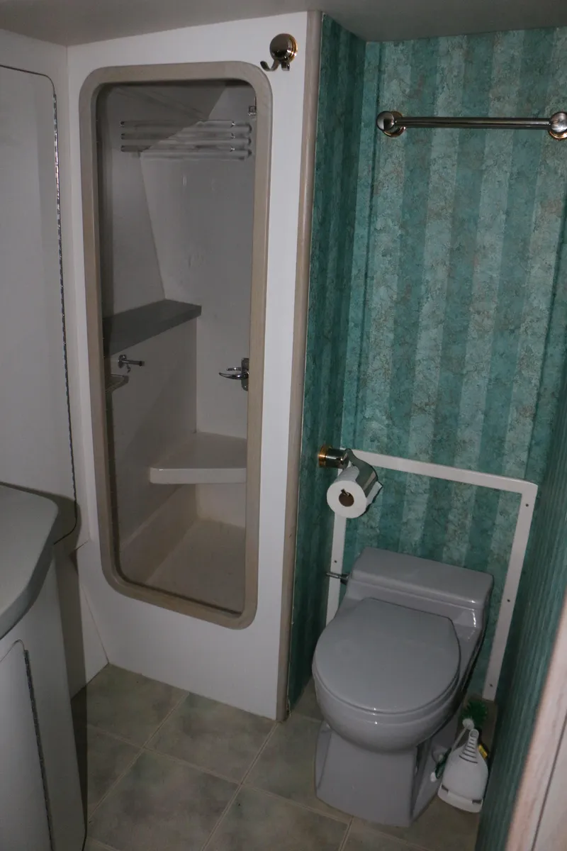 Slide: The Image of Bathroom interior of a 1990 Donzi 65 yacht with shower and toilet. - 24