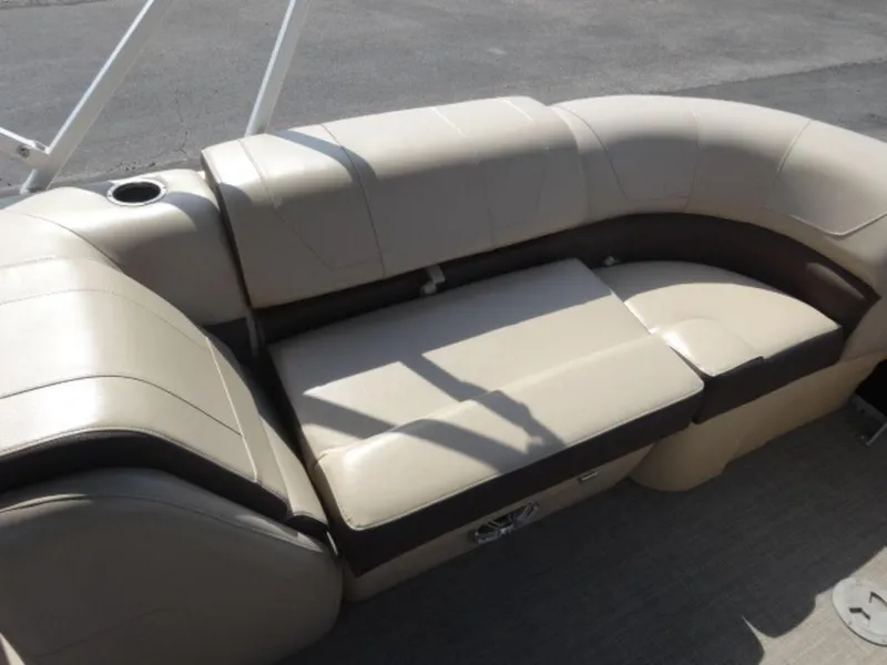 Slide: The Image of 2018 Sun Tracker 24XP3 boat seating with beige upholstery and cup holder. - 14