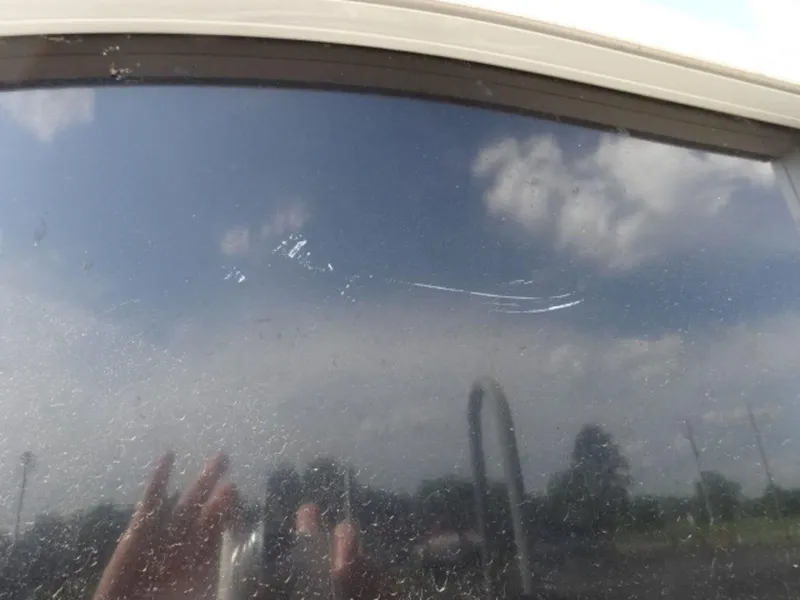 Slide: The Image of Reflection on Sun Tracker 24XP3 window, 2018 model, showing sky and clouds. - 18