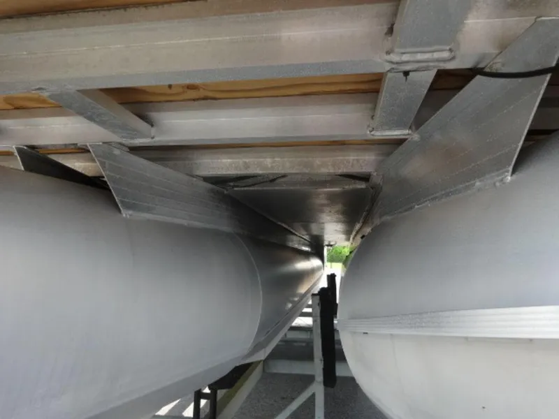 Slide: The Image of Underneath view of a 2018 Sun Tracker 24XP3 pontoon boat, showcasing aluminum pontoons and structure. - 4
