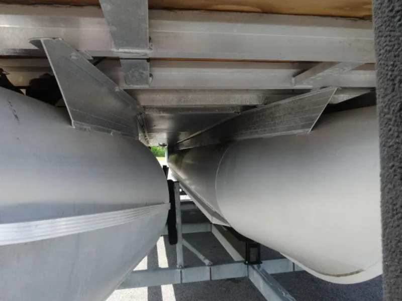 Slide: The Image of Underneath view of a 2018 Sun Tracker 24XP3 pontoon boat, showcasing pontoons and structural details. - 5