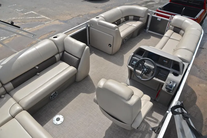 Slide: The Image of 2024 Sun Tracker Party Barge 20 DLX interior with spacious seating and modern helm. - 19