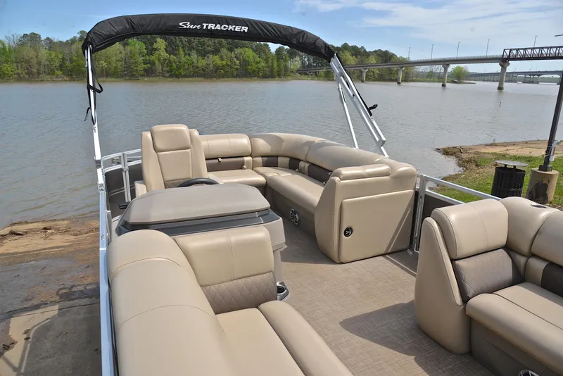 Slide: The Image of 2024 Sun Tracker Party Barge 20 DLX pontoon boat on a scenic lake. - 23