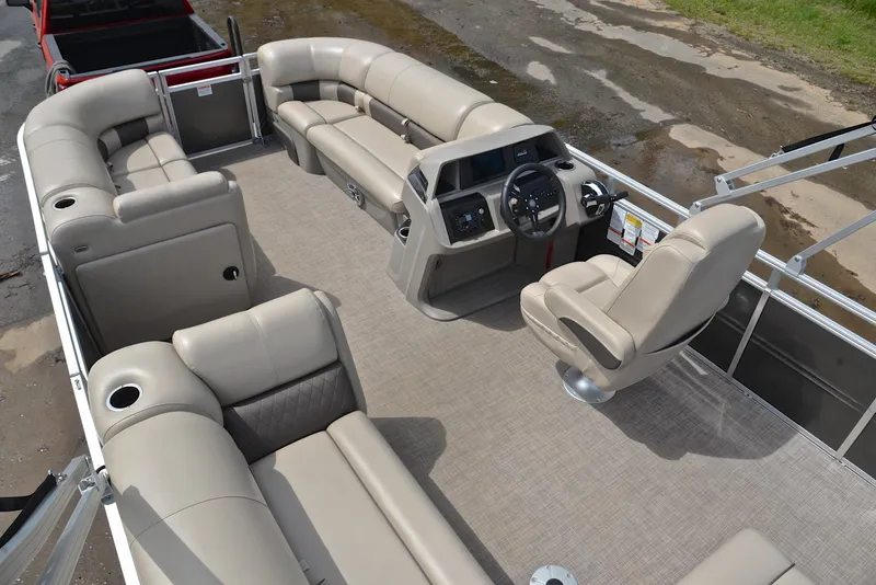 Slide: The Image of 2024 Sun Tracker Party Barge 20 DLX pontoon boat with spacious seating and modern helm. - 25