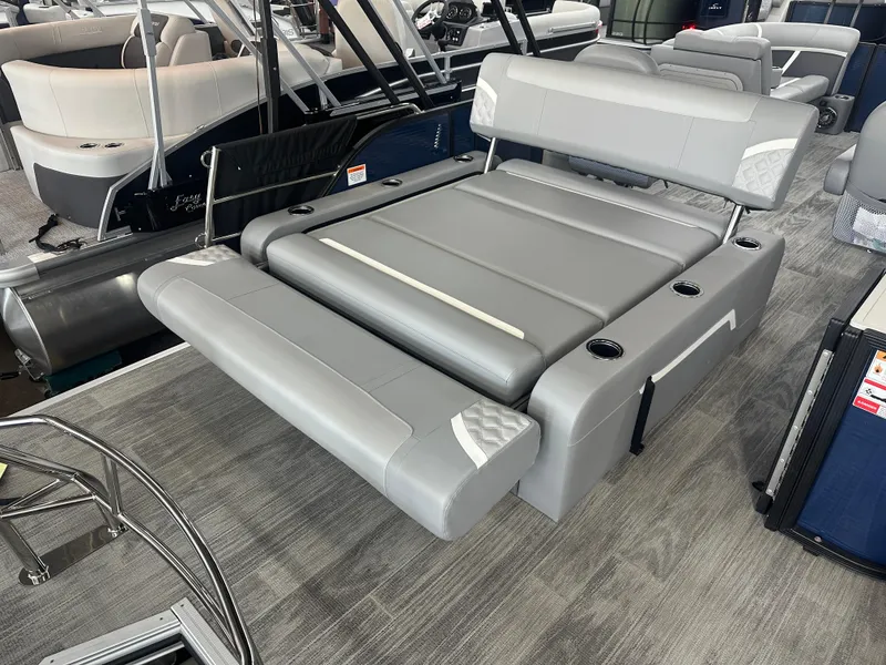 Slide: The Image of 2025 Crest Classic 220 boat with gray seating and cup holders, showcasing modern design and comfort. - 12