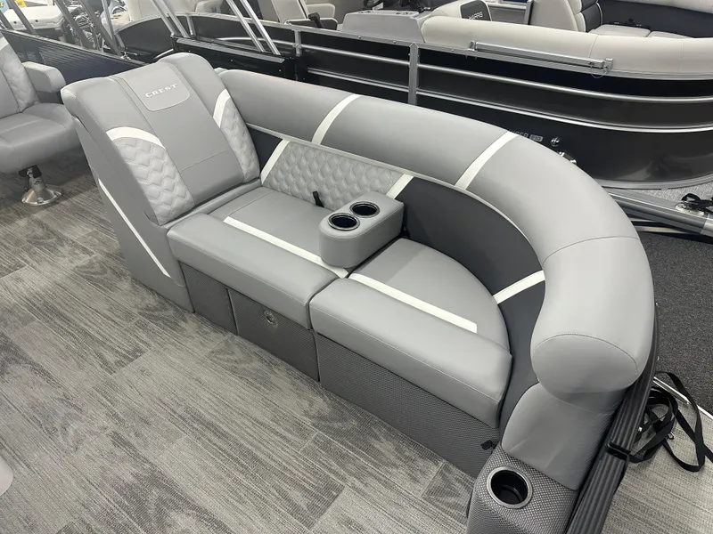 Slide: The Image of Luxurious seating on 2025 Crest Classic 220 boat, featuring gray upholstery and cup holders. - 3