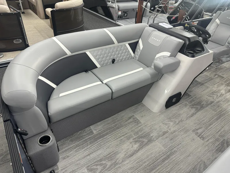 Slide: The Image of 2025 Crest Classic 220 boat interior with gray seating and modern design. - 4