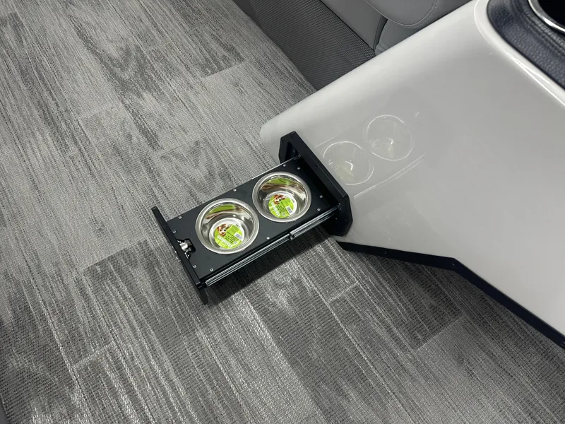 Slide: The Image of Pull-out cup holders in 2025 Crest Classic 220 boat interior. - 8