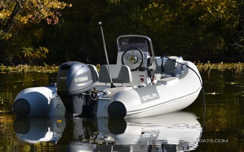 Slide: The Image of Inflatable Gala V360 boat with Yamaha motor on a calm lake, 2026 model. - 5