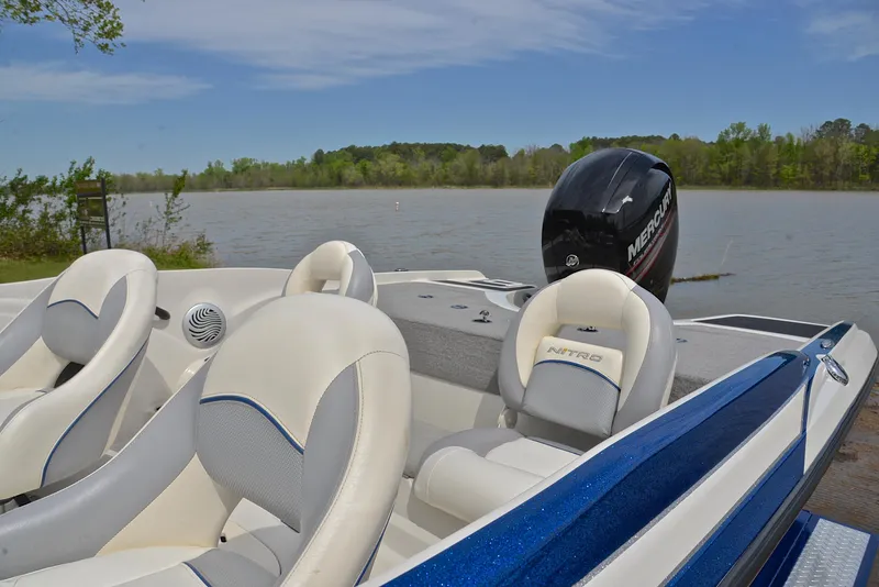 Slide: The Image of 2016 Nitro Z-7 Sport boat with Mercury engine on a serene lake. - 18