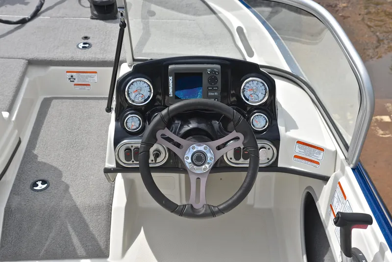 Slide: The Image of 2016 Nitro Z-7 Sport boat dashboard with steering wheel and gauges. - 25