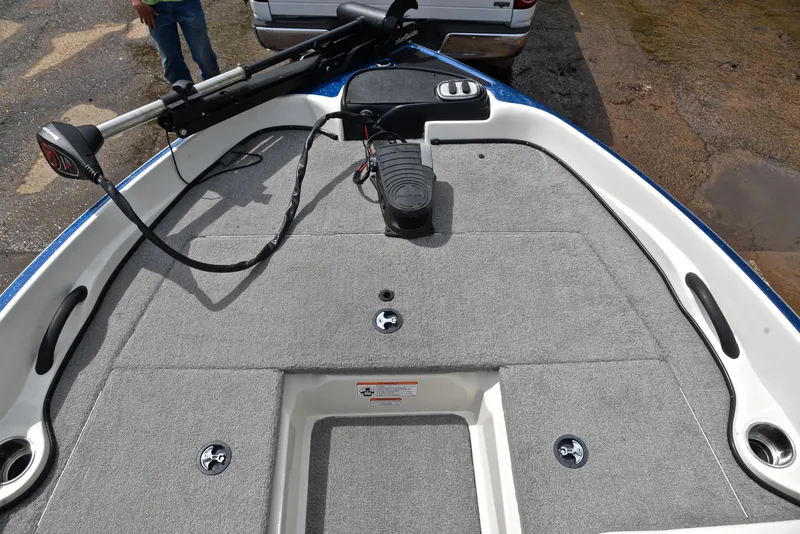 Slide: The Image of 2016 Nitro Z-7 Sport boat deck with trolling motor and carpeted surface. - 26
