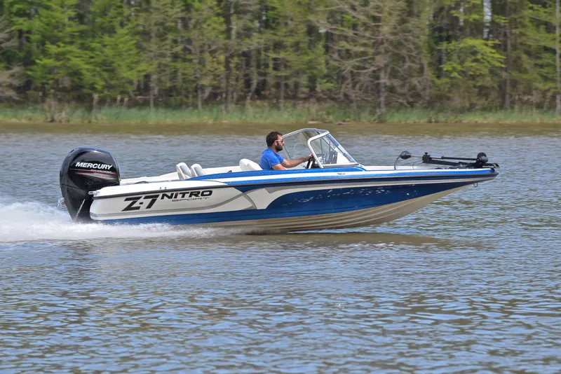 Slide: The Image of 2016 Nitro Z-7 Sport boat cruising on a lake with a Mercury engine. - 3