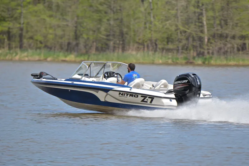 Slide: The Image of 2016 Nitro Z-7 Sport boat speeding on a lake with Mercury engine. - 4