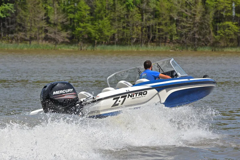 Slide: The Image of 2016 Nitro Z-7 Sport boat speeding on a lake with Mercury engine. - 5
