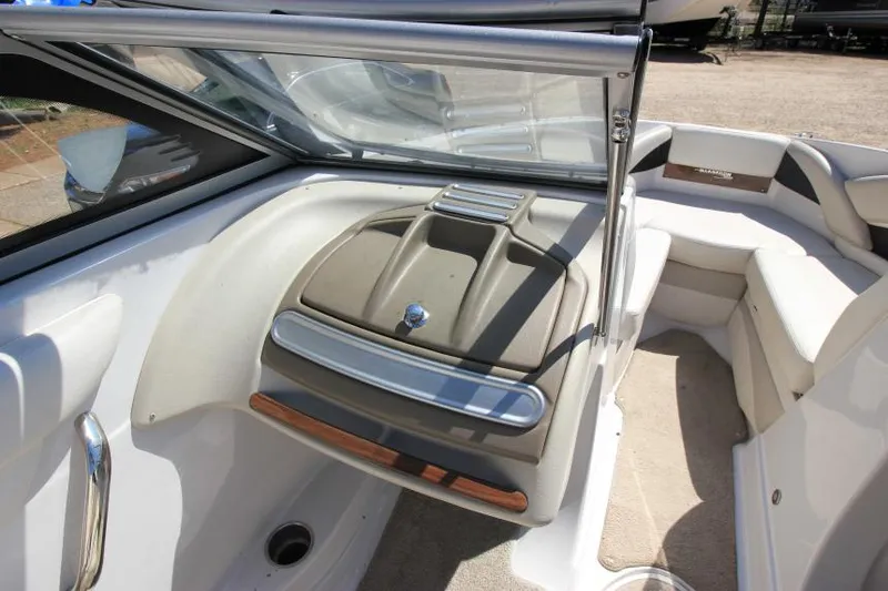 Slide: The Image of 2011 Glastron GLS 215 boat interior with seating and storage compartment. - 17