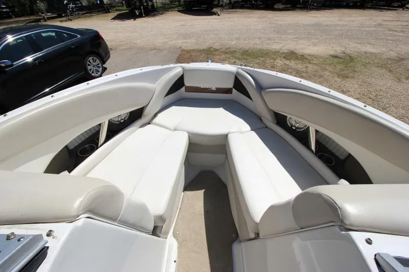 Slide: The Image of 2011 Glastron GLS 215 boat interior with white seating and spacious layout. - 19