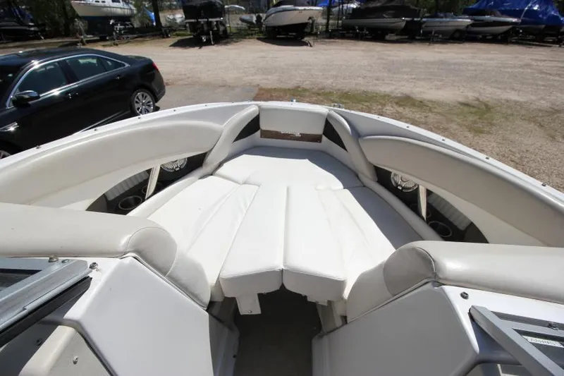 Slide: The Image of 2011 Glastron GLS 215 boat interior with white seating and spacious layout. - 21