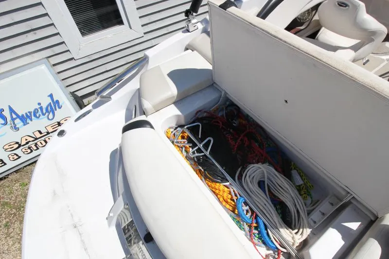 Slide: The Image of 2011 Glastron GLS 215 boat storage compartment with ropes and anchor. - 9