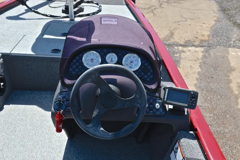 Slide: The Image of 2019 Bass Tracker Pro 170 dashboard with steering wheel and gauges. - 25