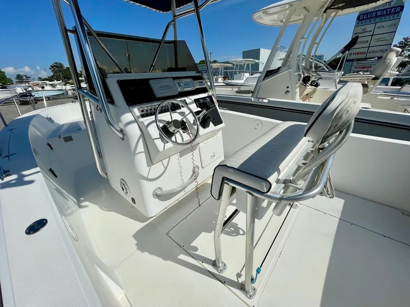 Slide: The Image of 2002 Seastrike 240 boat interior with steering console and seating. - 11