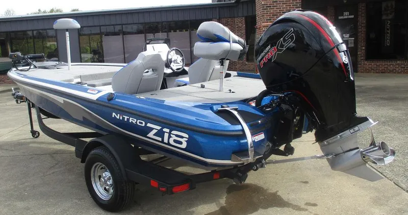 Slide: The Image of 2025 Nitro Z18 boat with powerful outboard motor, parked on a trailer. - 3