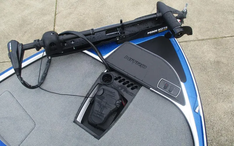 Slide: The Image of 2025 Nitro Z18 boat deck with Minn Kota trolling motor and control panel. - 8