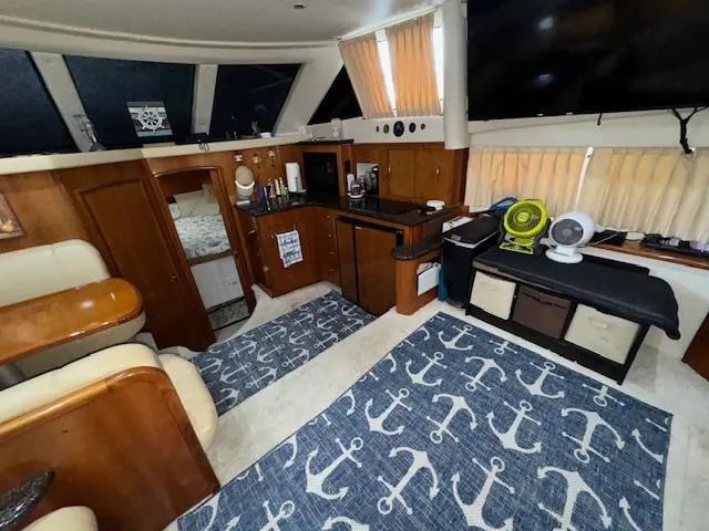 Slide: The Image of Interior of 2006 Carver 36 Motor Yacht with nautical-themed decor and wooden cabinetry. - 25