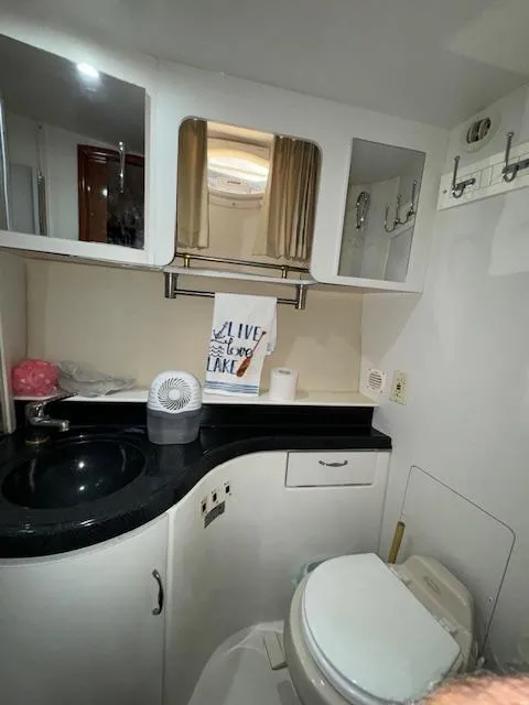 Slide: The Image of Bathroom interior of 2006 Carver 36 Motor Yacht with modern fixtures and storage. - 46