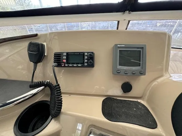 Slide: The Image of Control panel of a 2006 Carver 36 Motor Yacht with radio and navigation display. - 12