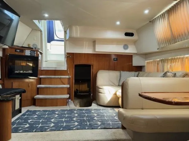 Slide: The Image of Interior of 2006 Carver 36 Motor Yacht with cozy seating and elegant wood finishes. - 28