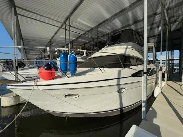 Slide: The Image of 2006 Carver 36 Motor Yacht docked under a covered marina. - 3